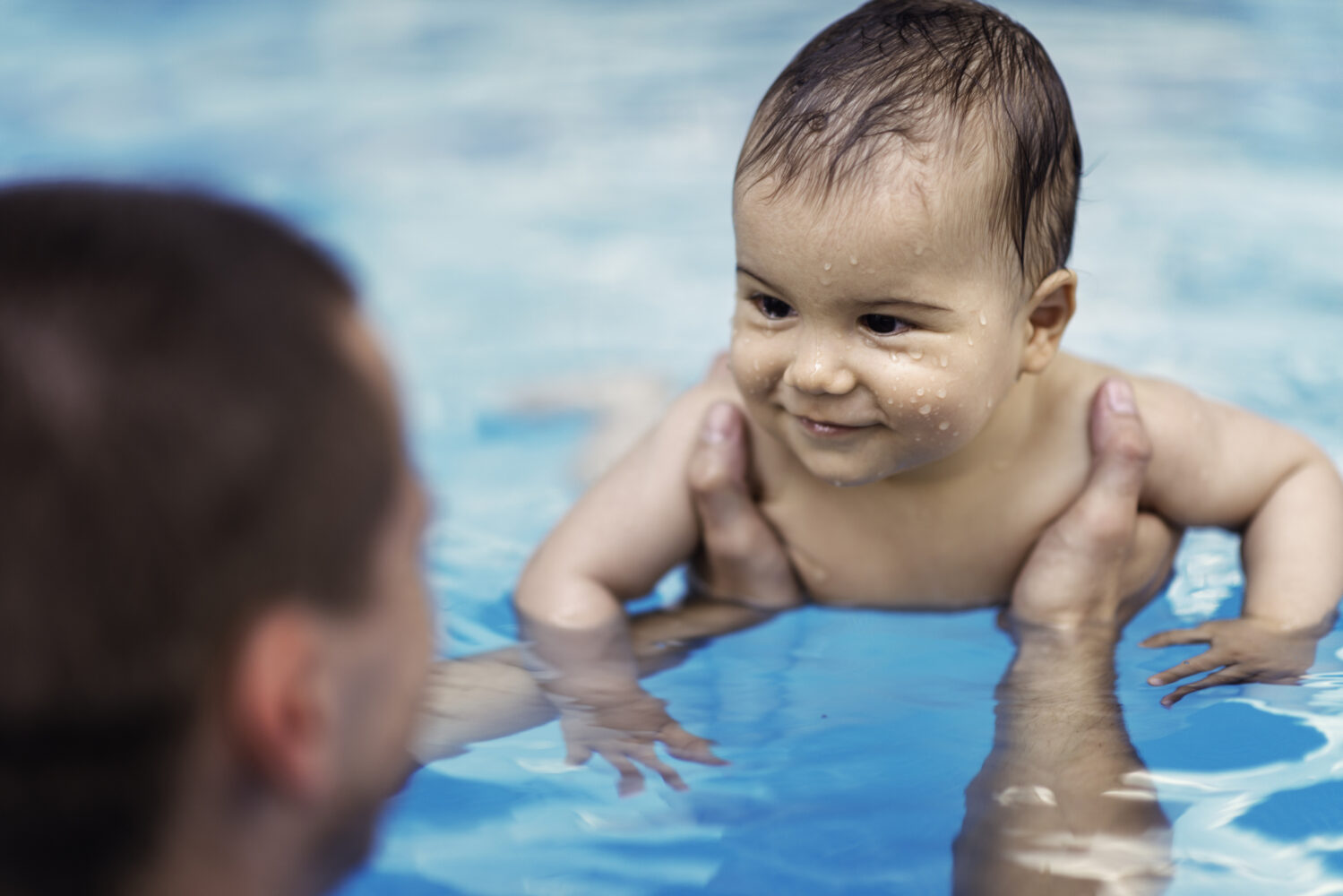 Smiling Baby in Swimming Pool